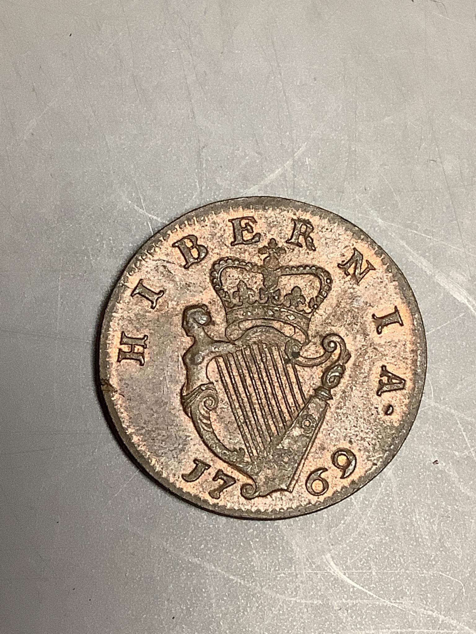 Ireland coins, a George III Halfpenny, 1769, Type II laureate bust with taller head, rev. crowned harp (DF 582; S.6613), tiny edge fault to rev. at 8 o’clock otherwise good VF or better, traces of lustre